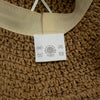 Beige straw sun hat with woven straw material and matching fabric band from coffee and daisies collection