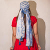 Blue and white patterned summer scarf with tassels made of light fabric ideal for warm weather wear