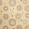 Beige recycled kraft gift wrap with black heart sunburst patterns and scattered stars in a 1m by 50cm sheet
