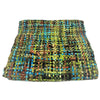 A colorful handwoven acrylic snood with a textured pattern in green blue black and earthy tones