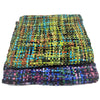 Stacked acrylic snoods with vibrant multicolored woven patterns in soft acrylic textile showing visible texture