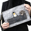 Gray felt tablet pouch with finger puppets featuring embroidered penguin and elephant appliqués with orange stitching