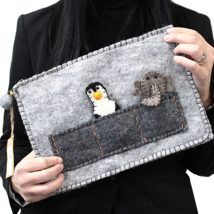 Gray felt tablet pouch with finger puppets featuring embroidered penguin and elephant appliqués with orange stitching