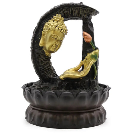 Golden buddha head tabletop water feature with black resin base and lotus design for indoor tabletop water use