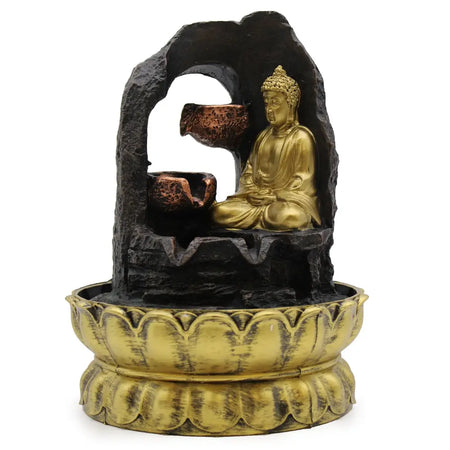 Golden meditating buddha tabletop water feature with black rock archway and copper bowls with water details