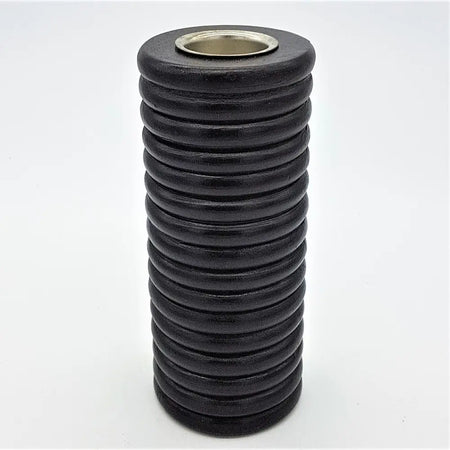 Tall ribbed wooden tealight holder in black with a cylindrical shape and metallic rim for candle use