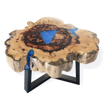 Rustic tamarind wood coffee table with a natural slab top featuring blue resin and black metal legs