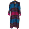 A tapestry style maxi shirt dress with long sleeves and horizontal teal blue magenta and deep purple paisley stripes