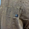 Brown textured cotton shirt with small black label and white logo shown with orange thai fisherman pants mandala mantra
