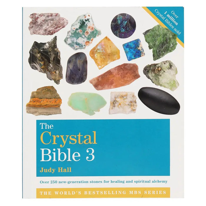 The crystal bible 3 by judy hall is a hardcover book with a white cover showing colorful crystal images in a grid layout
