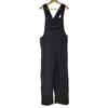 The Window, Milford Haven black jumbo cord dungarees with front pocket and adjustable straps on a wooden hanger.