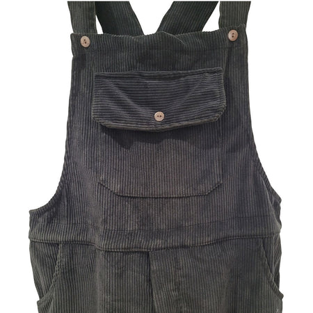 The Window, Milford Haven black jumbo cord dungarees featuring a buttoned front pocket and adjustable shoulder straps.