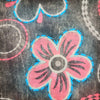 The Window, Milford Haven black cotton hooded top featuring a pink and blue floral circle print pattern.