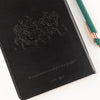 The Window, Milford Haven black leather-effect notebook featuring an embossed warrior design and Sun Tzu quote.