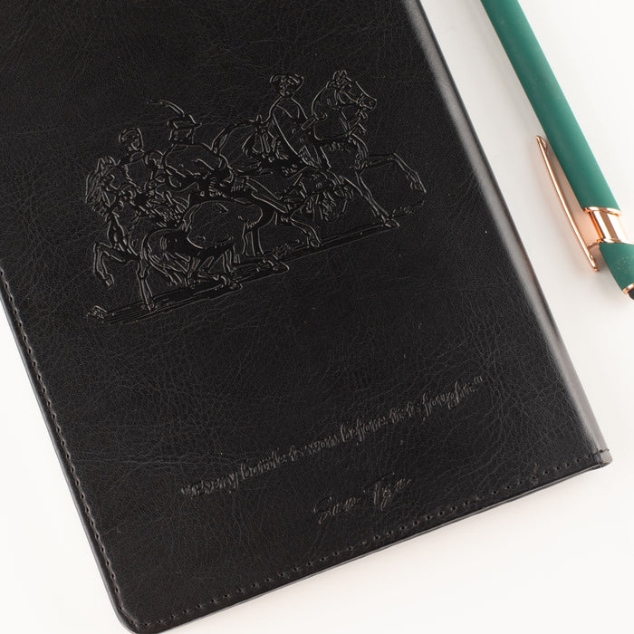 The Window, Milford Haven black leather-effect notebook featuring an embossed warrior design and Sun Tzu quote.