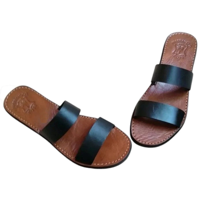 The Window, Milford Haven handmade black leather double strap sandals with a tan footbed and minimalist design.