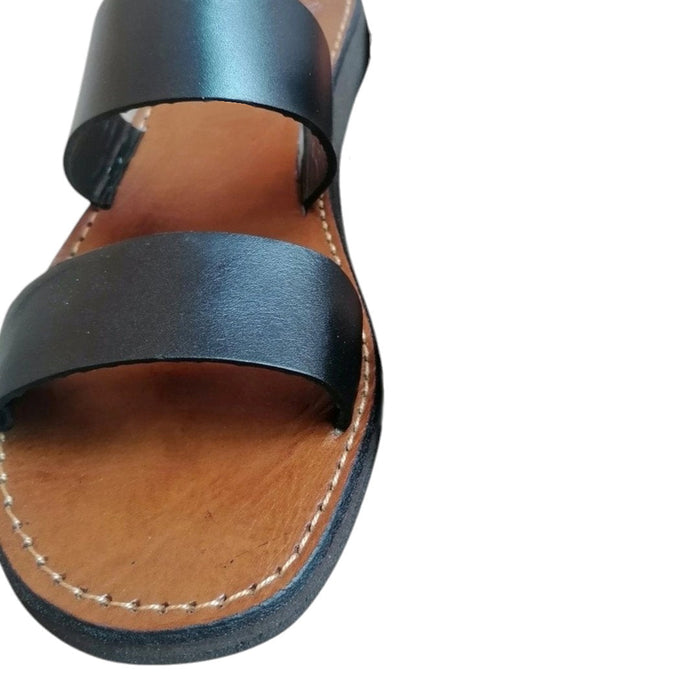 The Window, Milford Haven handmade black leather sandals with a minimalist double strap design and flat organic sole.