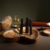 The Window, Milford Haven black tourmaline six-face obelisk points on a wooden tray with dried lavender and incense.
