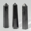 Three polished black tourmaline six-face obelisk points from The Window, Milford Haven for grounding and protection.