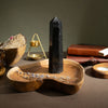 The Window, Milford Haven black tourmaline six-face obelisk crystal point on a wooden tray for mindful decor