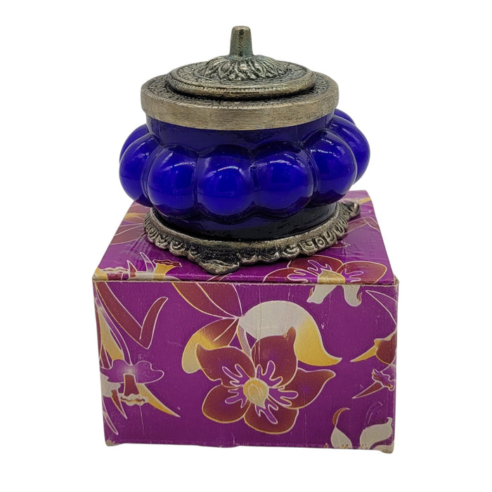 The Window, Milford Haven Nag Champa scented soy candle in a blue pumpkin-shaped glass jar with ornate metal lid