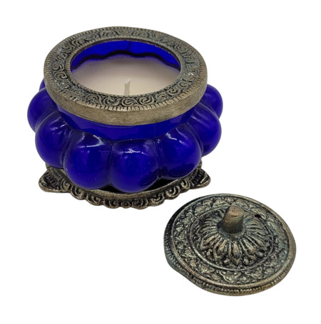 The Window, Milford Haven blue Nag Champa scented soy candle in an antique-style pumpkin glass jar with metal lid.