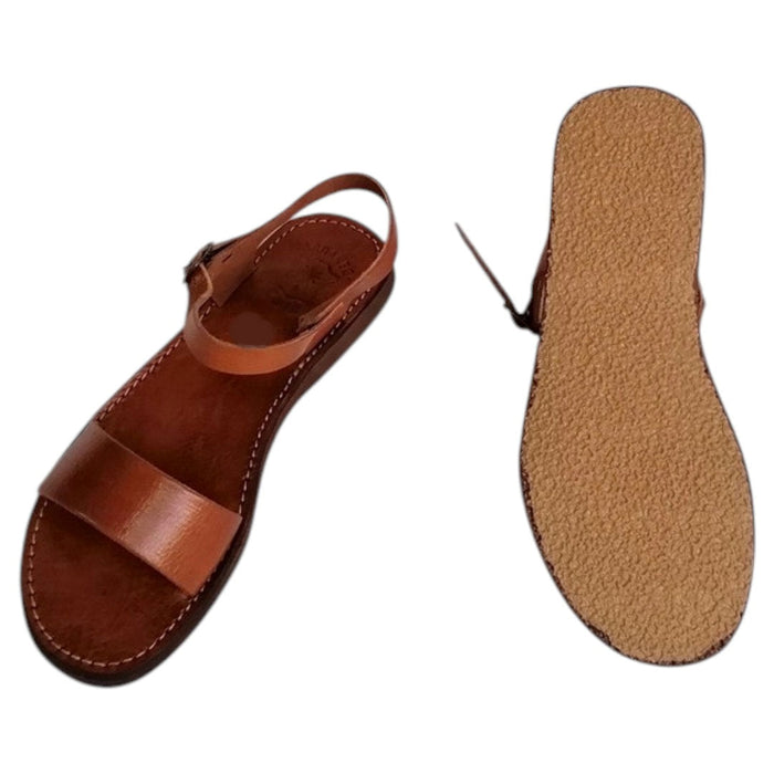 The Window, Milford Haven handmade brown leather sandals with a single strap and ankle buckle on a textured flat sole