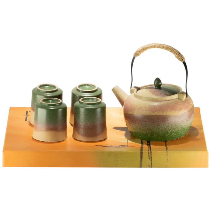 The Window, Milford Haven ceramic Japanese kyusu style tea set with a teapot and four matching green and beige cups.