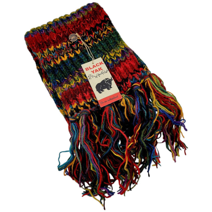 The Window, Milford Haven chunky hand-knit wool scarf in multi-coloured electric stripes with long fringe detail.