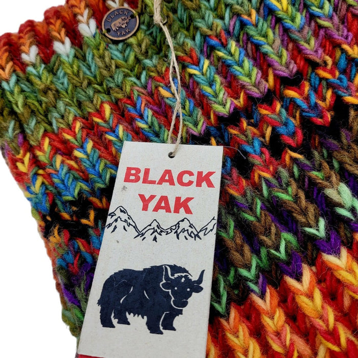 The Window, Milford Haven chunky hand-knit wool scarf in multi-coloured electric stripe with Black Yak brand tag