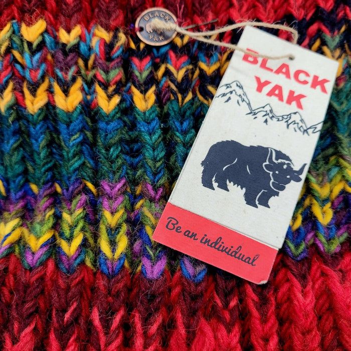 The Window, Milford Haven chunky hand-knit wool scarf in red with multi-coloured electric stripes and brand tag.