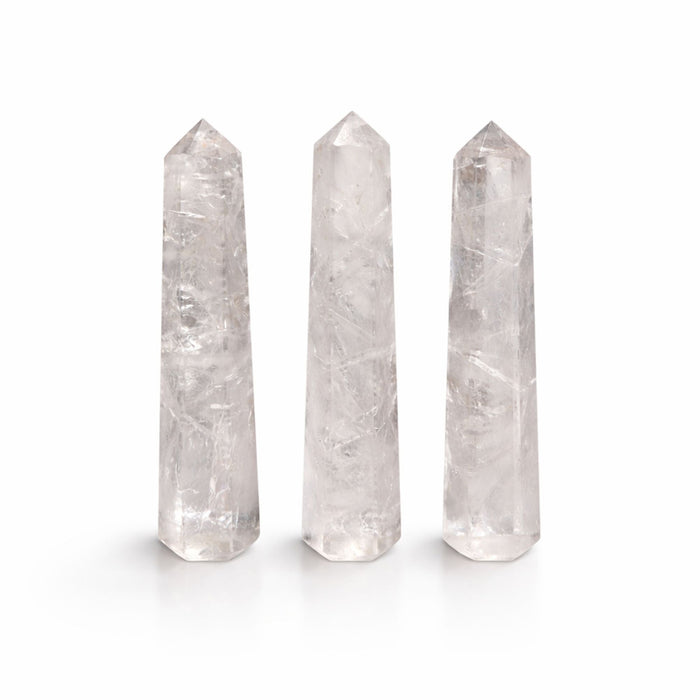 Three The Window, Milford Haven clear quartz six-face obelisk points with polished finish on a white background.
