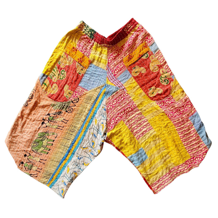 The Window, Milford Haven cropped Kantha cotton trousers featuring a vibrant patchwork design and red elastic waistband.
