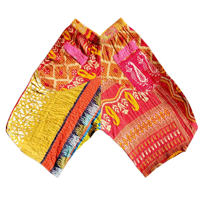 The Window, Milford Haven cropped Kantha cotton trousers featuring vibrant red and yellow patchwork patterns.
