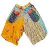 The Window, Milford Haven cropped cotton Kantha trousers featuring a yellow waistband and vibrant patchwork patterns.