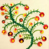The Window, Milford Haven hand-embroidered Christmas card featuring a green branch motif with red and gold sequins.