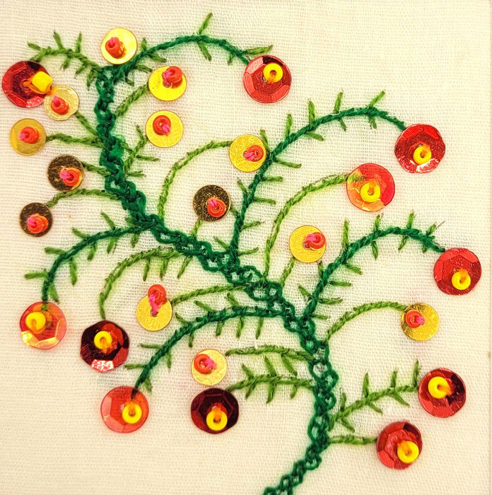 The Window, Milford Haven hand-embroidered Christmas card featuring a green branch motif with red and gold sequins.