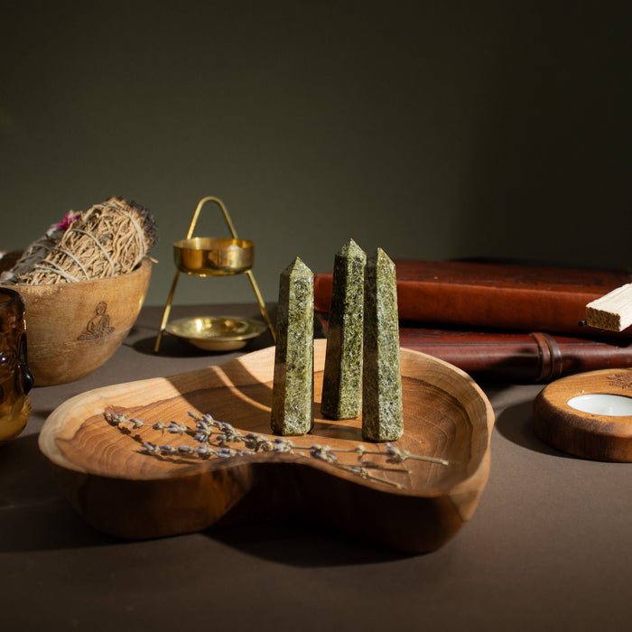 The Window, Milford Haven green epidote six-face obelisk crystal points displayed on a wooden heart-shaped tray.