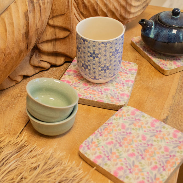 The Window, Milford Haven square mango wood coasters with a delicate floral pattern in pastel pinks and greens.