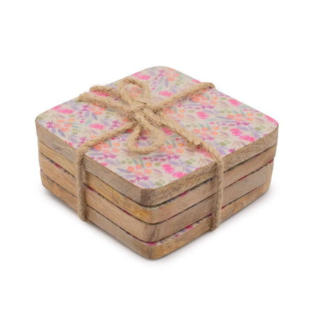 The Window, Milford Haven set of four square mango wood coasters featuring a delicate pink and green floral pattern.
