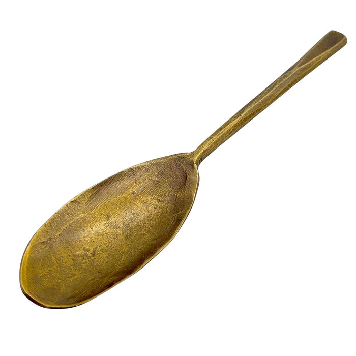 The Window, Milford Haven gold-toned forged metal oval spoon with a rustic antique finish and textured surface.