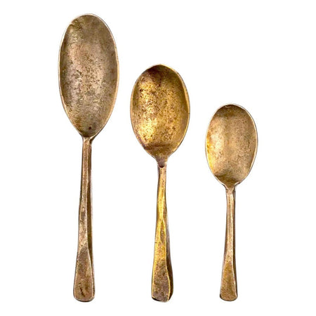 The Window, Milford Haven forged antique-finished oval metal spoons in three sizes with a rustic gold-toned texture.