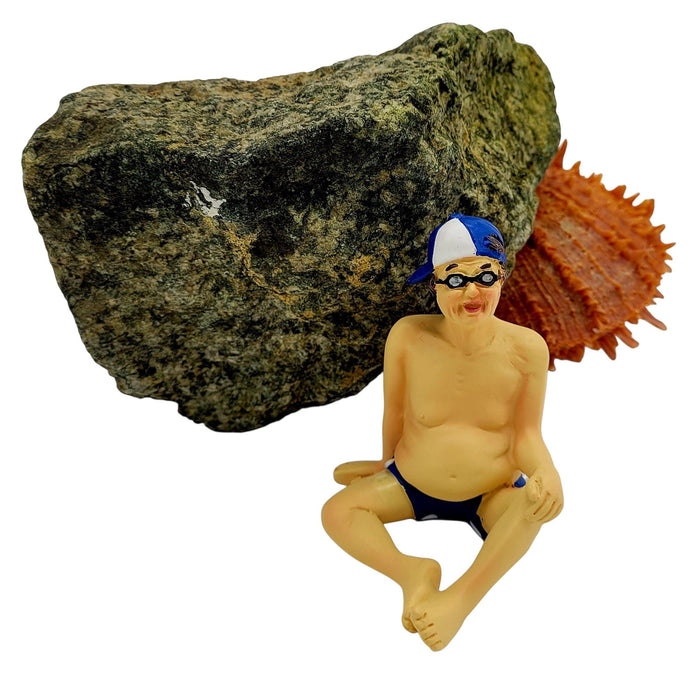 The Window, Milford Haven resin gent sunbather shelf sitter figure wearing blue swimming trunks and a baseball cap.