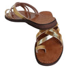 The Window, Milford Haven handmade gold leather sandals with crossed straps and a comfortable flat sole.