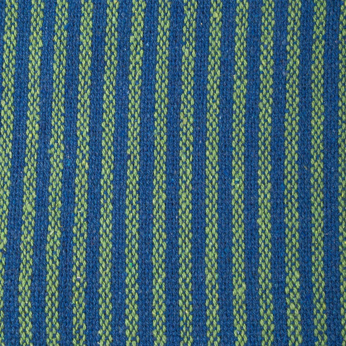 The Window, Milford Haven recycled cotton throw featuring a textured green and blue vertical striped pattern.