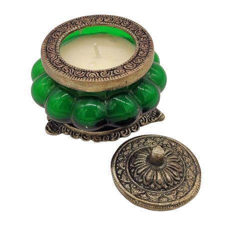 The Window, Milford Haven Song Of India green glass scented candle in an antique-style embossed white metal jar