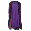The Window, Milford Haven GRINGO fairtrade long-sleeved smock dress with purple, blue, and floral panelled cotton fabric.