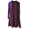 The Window, Milford Haven GRINGO FAIRTRADE long-sleeved smock dress with purple, green, and red circle print panels.
