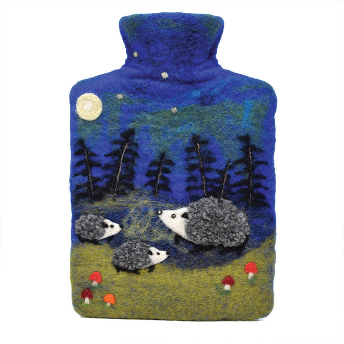 The Window, Milford Haven Black Yak wool felt hot water bottle featuring a blue night forest scene with hedgehogs.