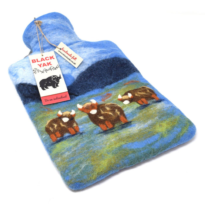 The Window, Milford Haven Black Yak wool felt hot water bottle featuring a hand-crafted Highland Cow landscape design.